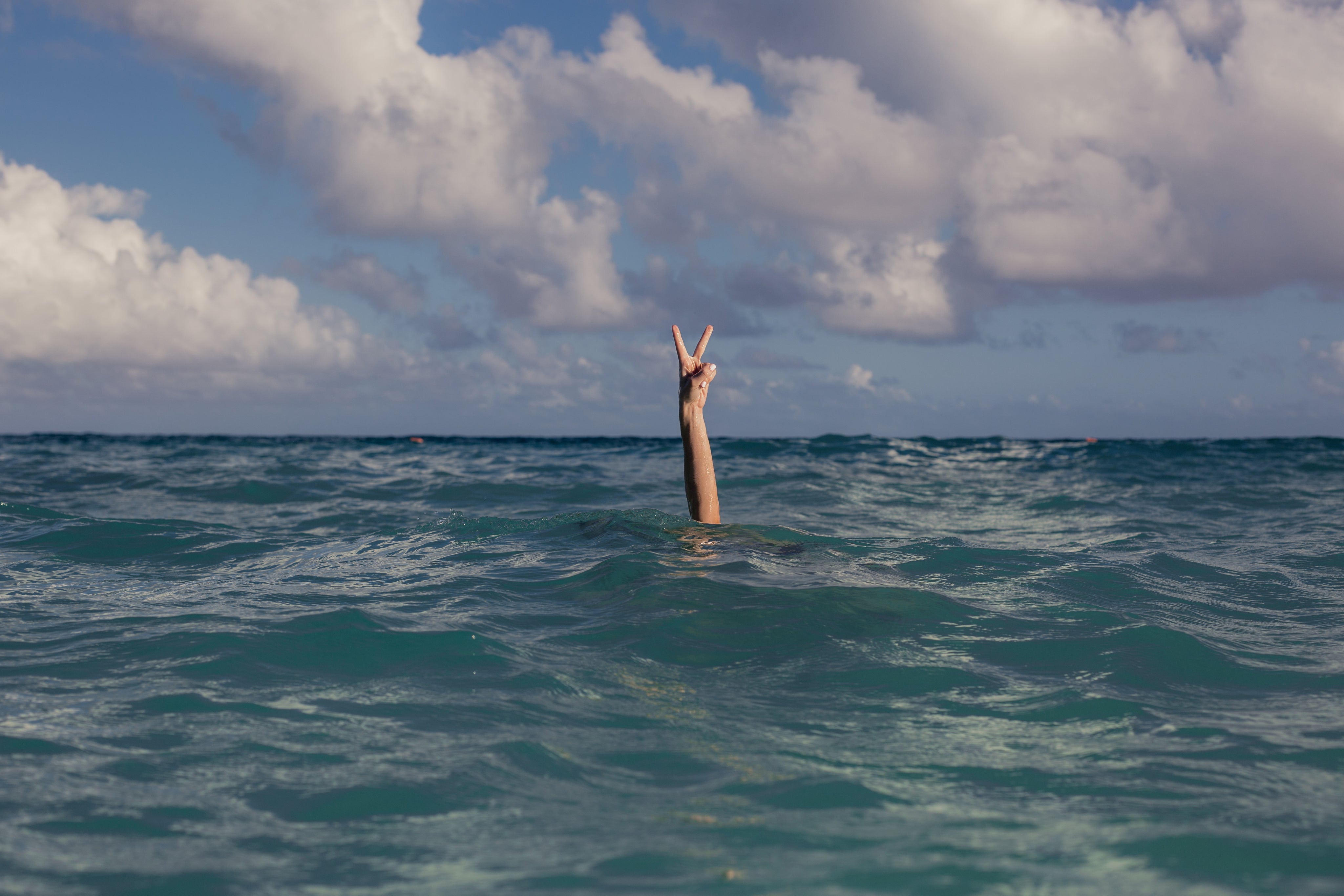 vacation-peace-sign-in-ocean - Watershed Brand