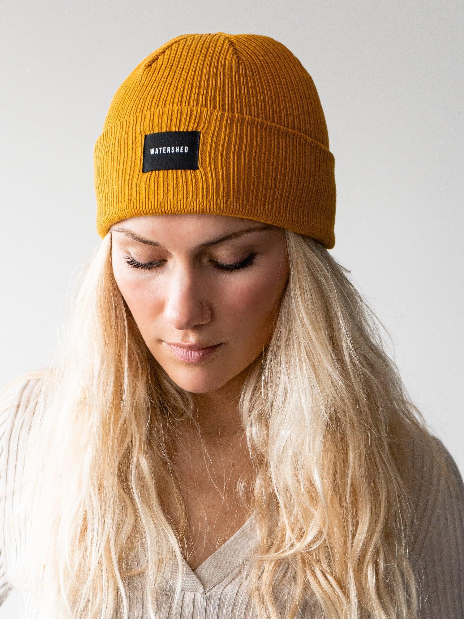 Mustard Organic Ridge Beanie - Embrace eco-friendly fashion with our mustard-colored ridge beanie, crafted from organic materials for a warm and stylish winter accessory.