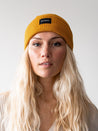 Organic Mustard Beanie - Stay cozy and sustainable with our eco-friendly mustard-colored beanie, a perfect choice for a warm and stylish winter accessory.